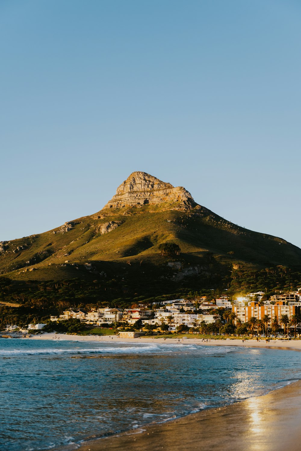 a view of a beach with a mountain in the background