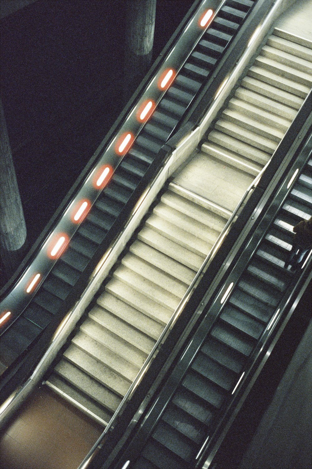 an escalator that has some lights on it