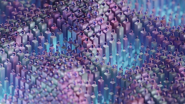 A 3D abstract artwork featuring numerous small, upright rectangular prisms arranged closely together. Above the prisms are small, perfectly round metallic spheres that appear to be resting on or hovering just above the surface of the prisms. The colors mainly consist of iridescent shades of purple, blue, and teal, creating a visually striking pattern with a reflective quality.