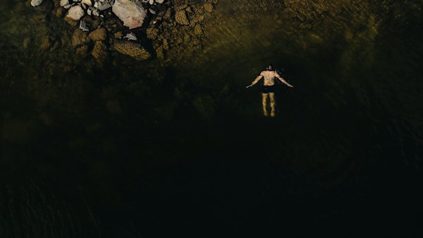 A swimmer in Prosperous Lake in summer, from above — Yellowknife, Canada