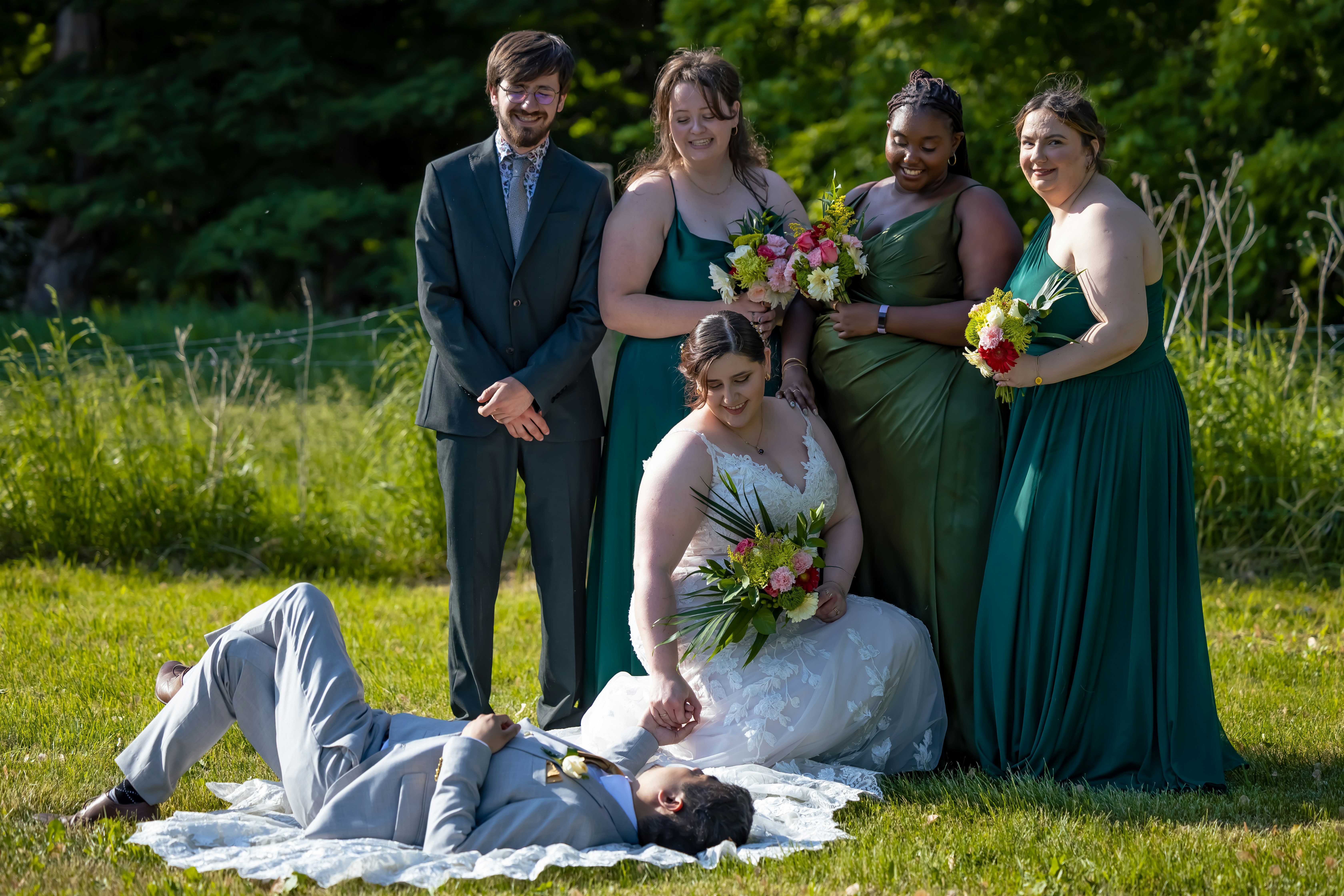 a group of people that are standing in the grass