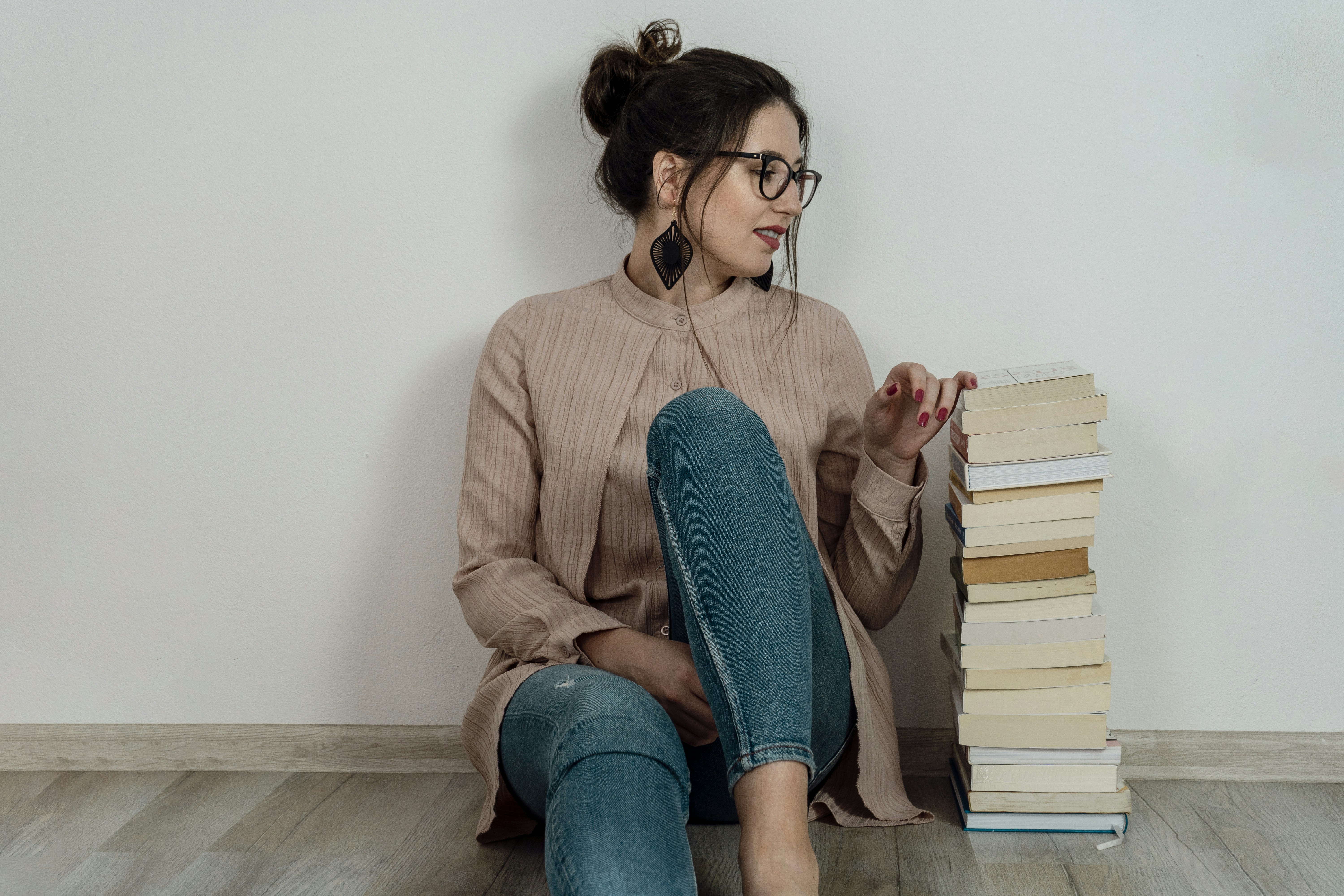 Woman with stack of books