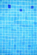 a blue tiled swimming pool with blue tiles