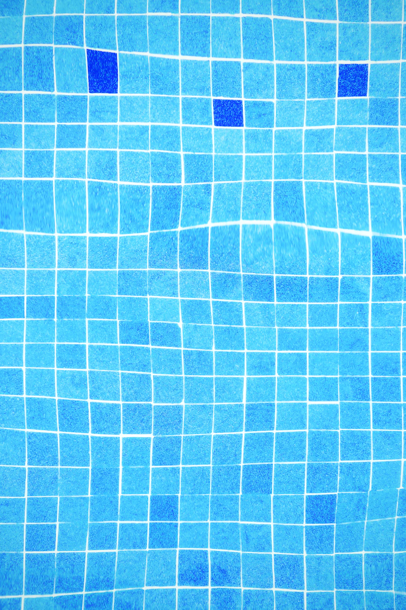 Blue tiled swimming pool water
