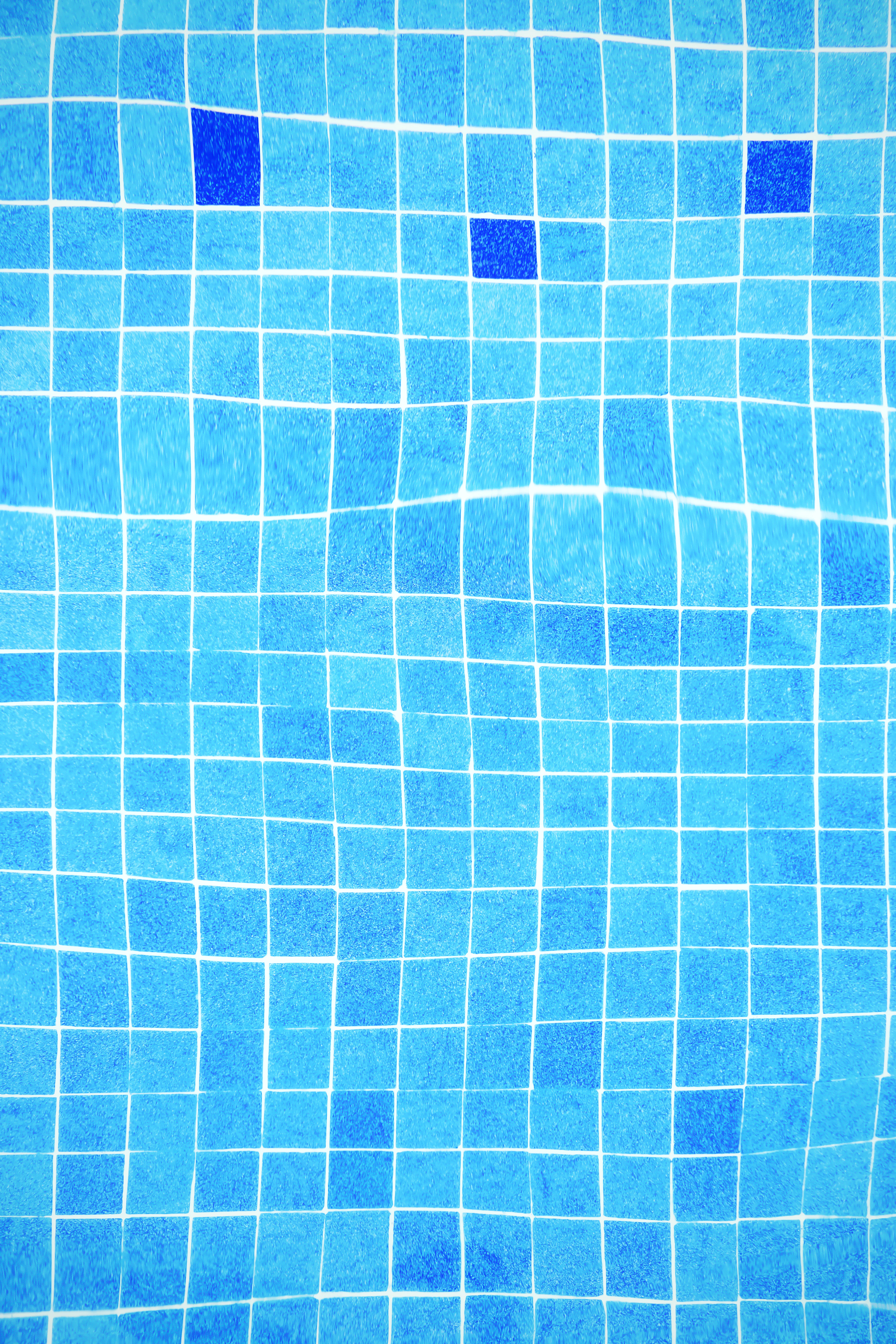 Blue tiled swimming pool with epoxy grout joints