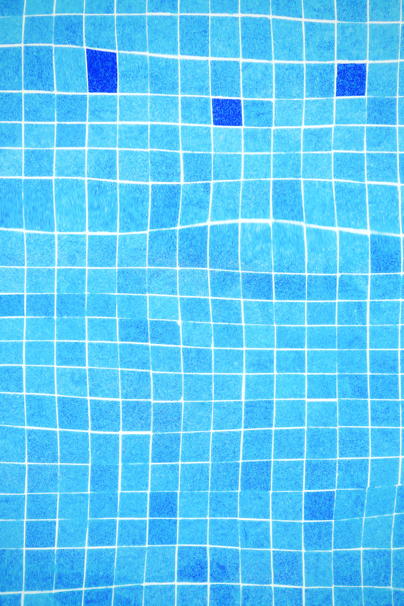Pool tile waterline scrubbed clean of calcium buildup
