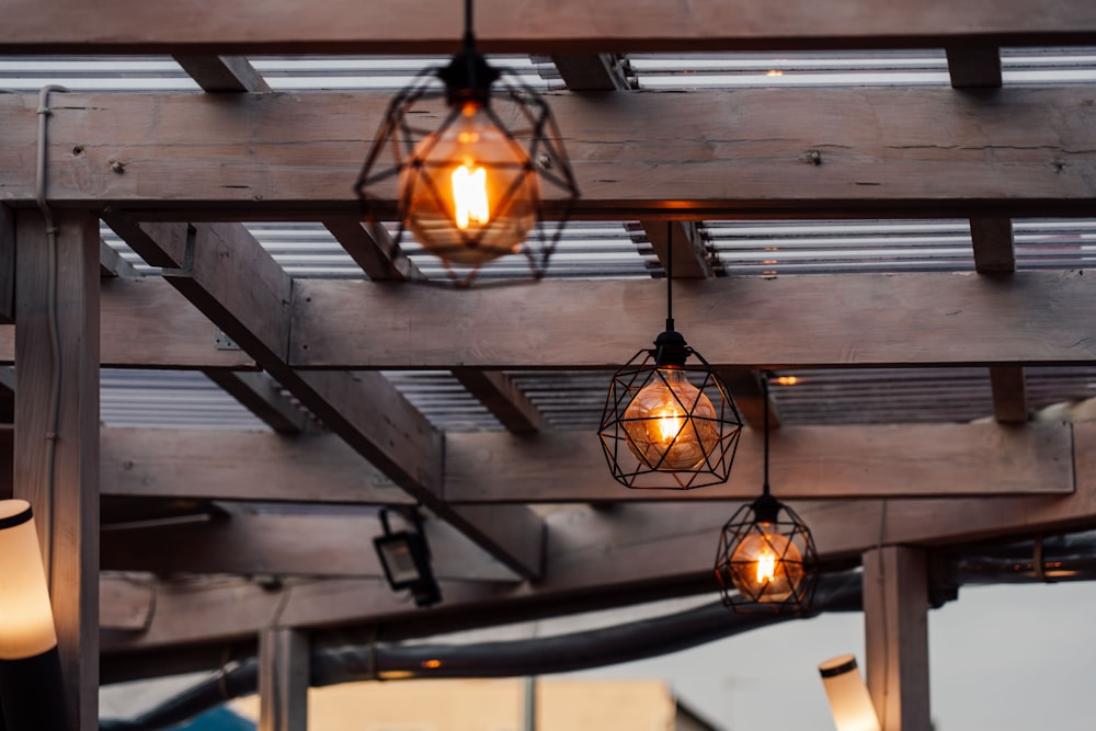 a group of lights hanging from a wooden structure