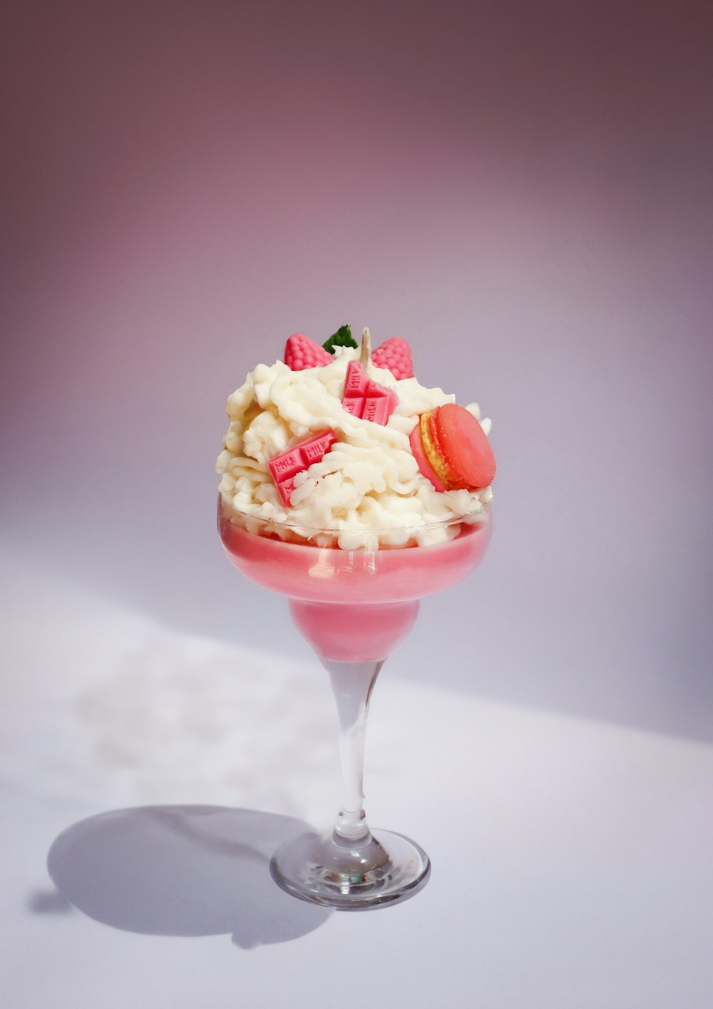 a dessert sundae with strawberries and whipped cream