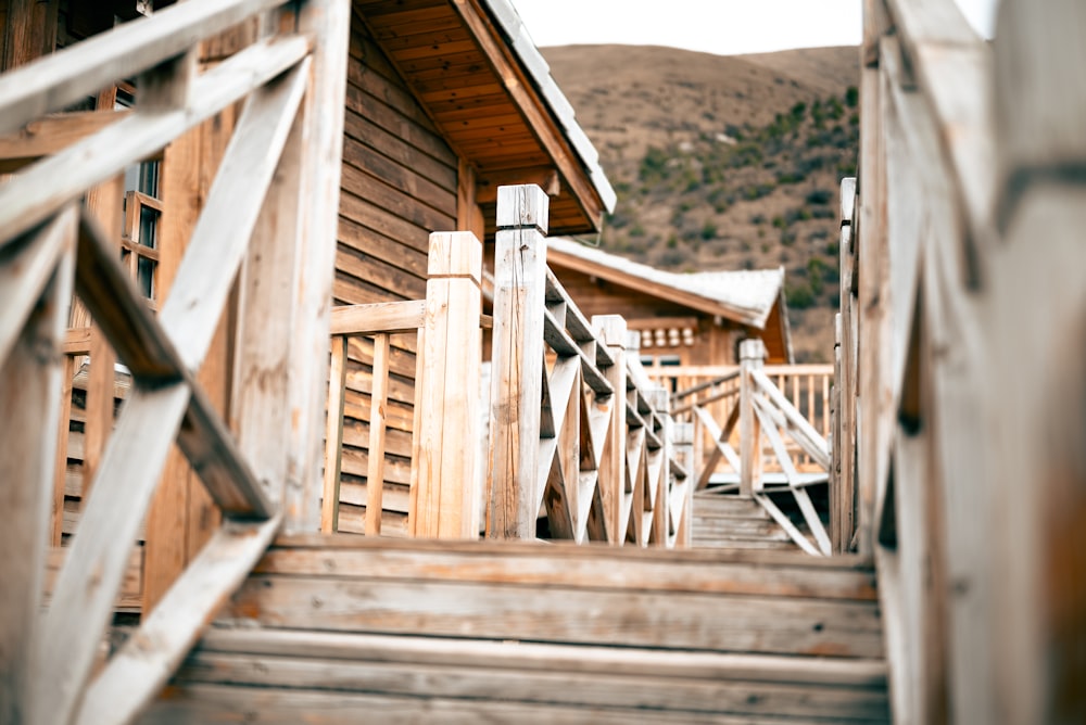 a set of stairs leading to a wooden cabin