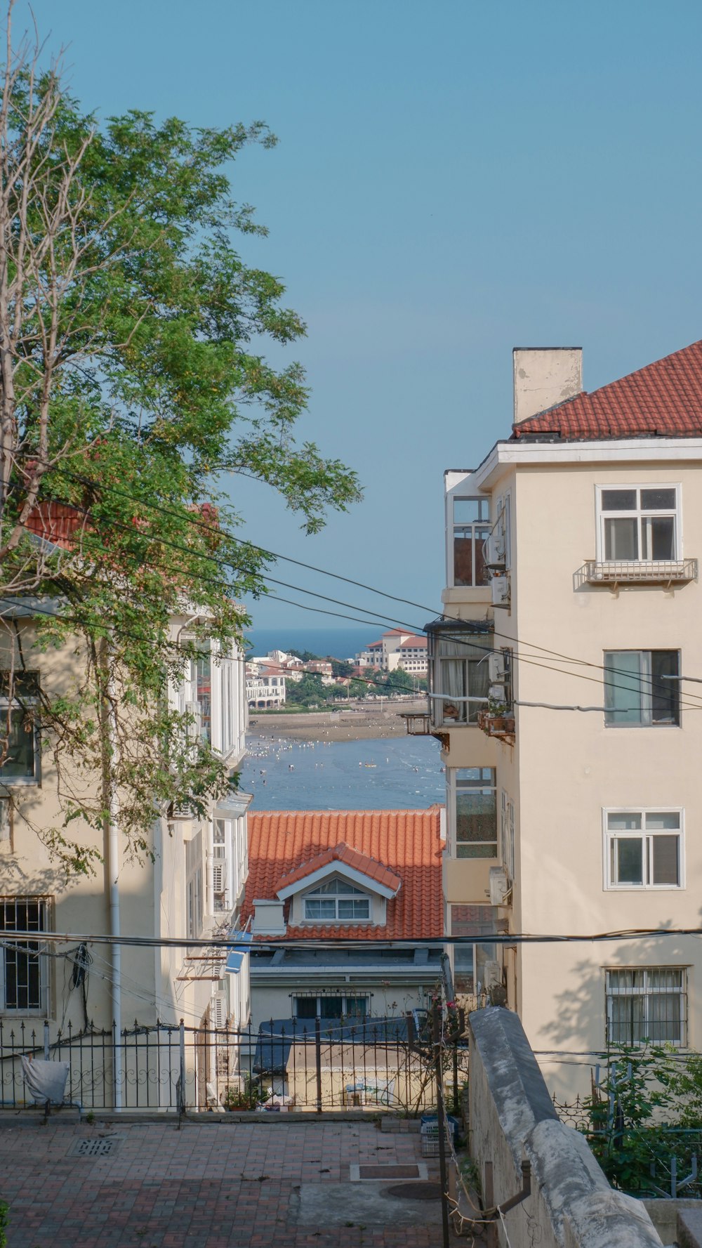 a view of some buildings and a body of water