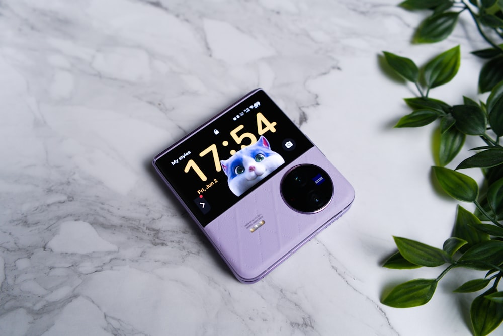 a cell phone sitting on top of a marble counter