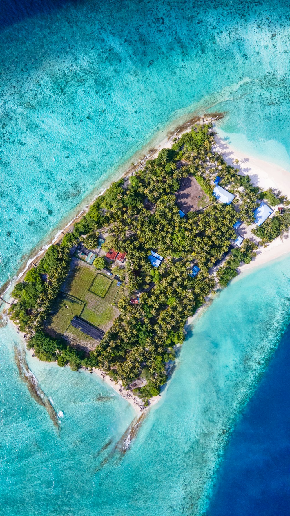 an aerial view of an island in the middle of the ocean