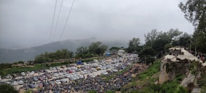 Front view of the Valley View villa showcasing the spacious parking area with cars and bikes neatly arranged