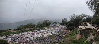 Front view of the Valley View villa showcasing the spacious parking area with cars and bikes neatly arranged