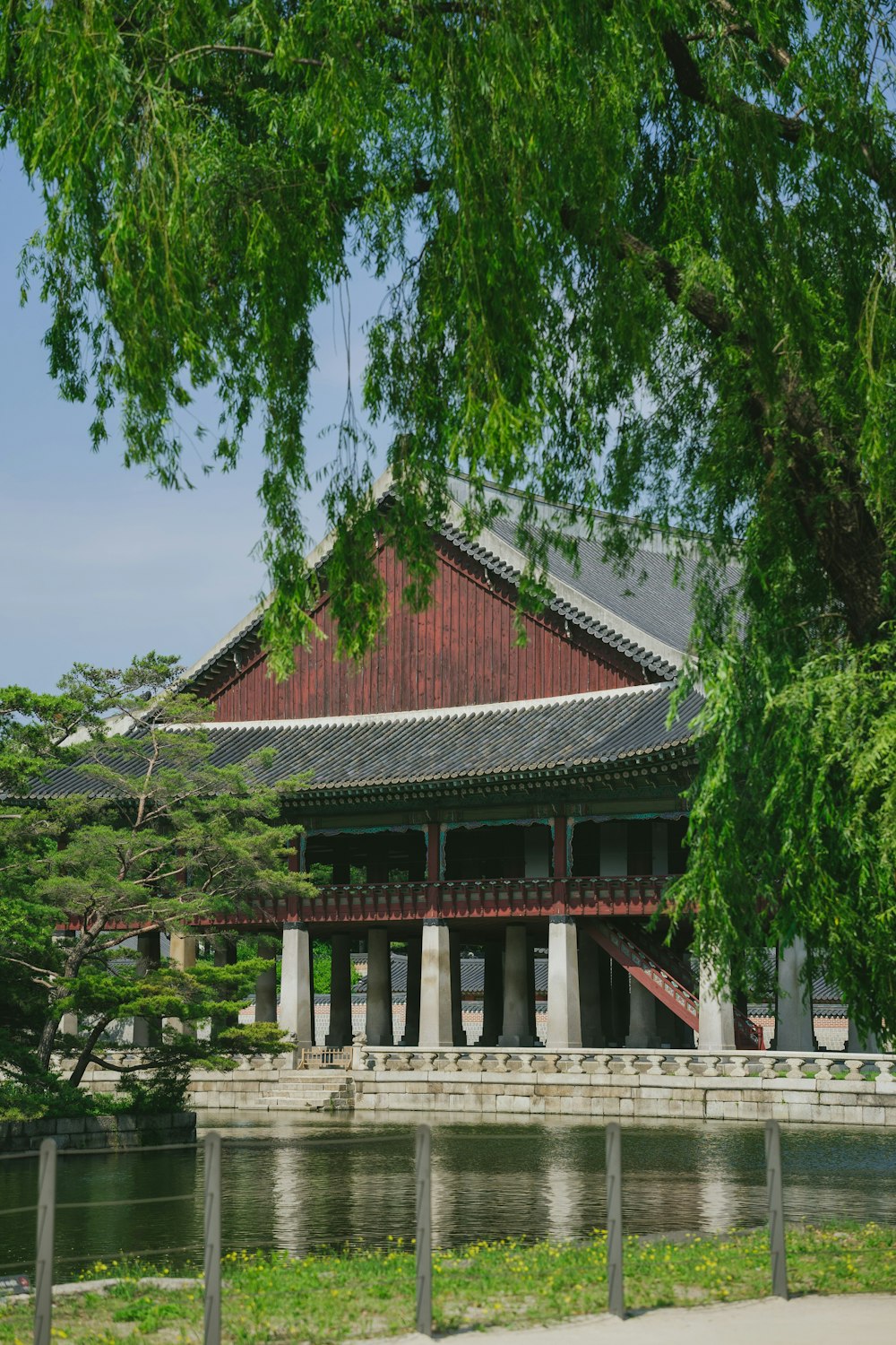 a large building sitting next to a body of water