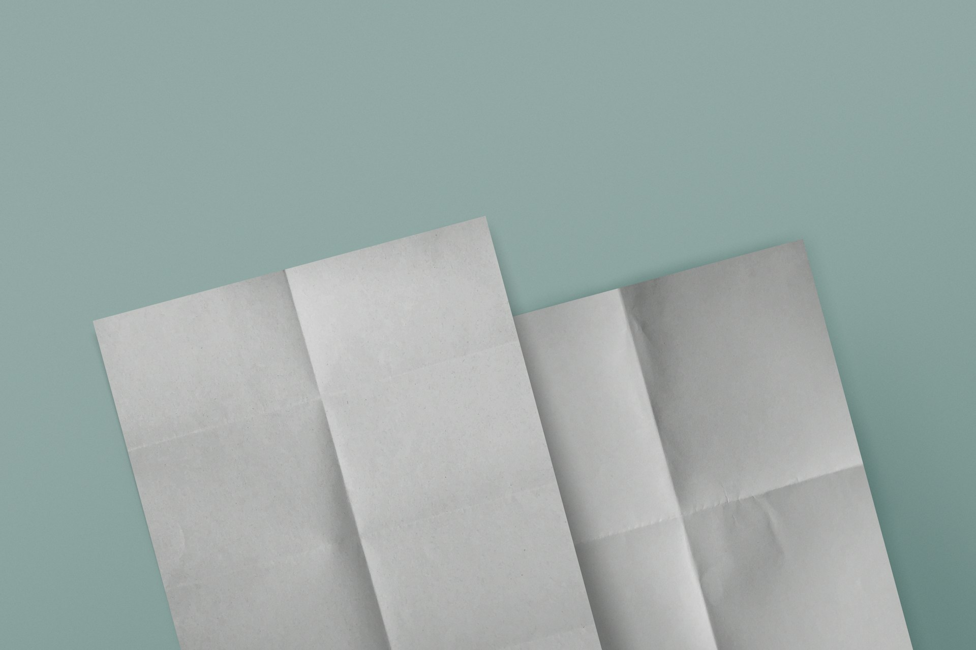 three pieces of white paper on a blue background