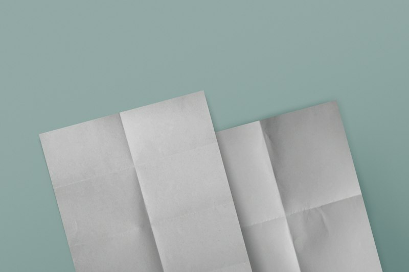 Folded paper layout on a teal background