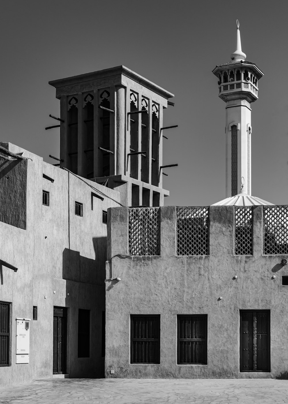 a black and white photo of a building with a tower