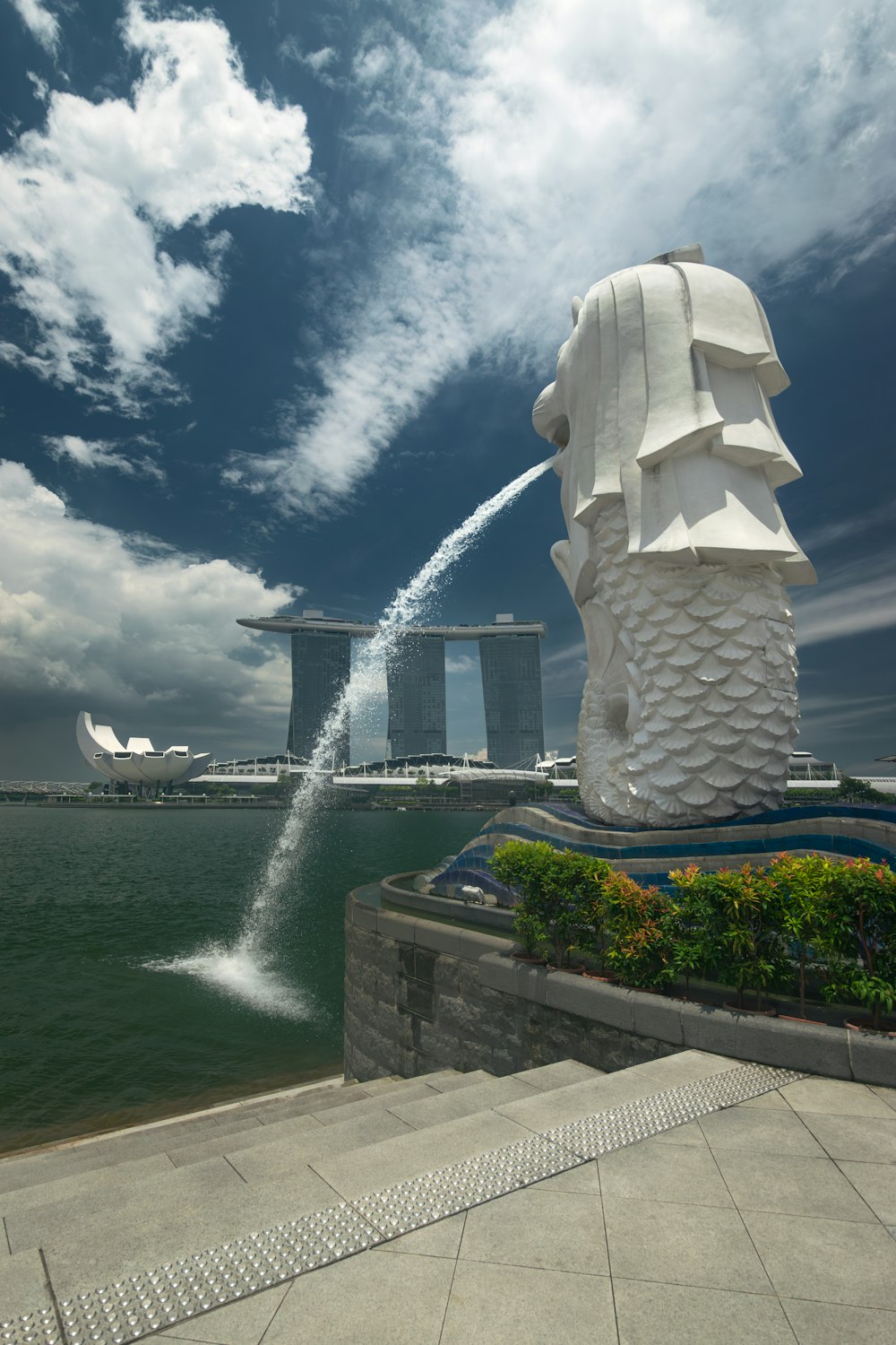 a water spouting out of the top of a statue