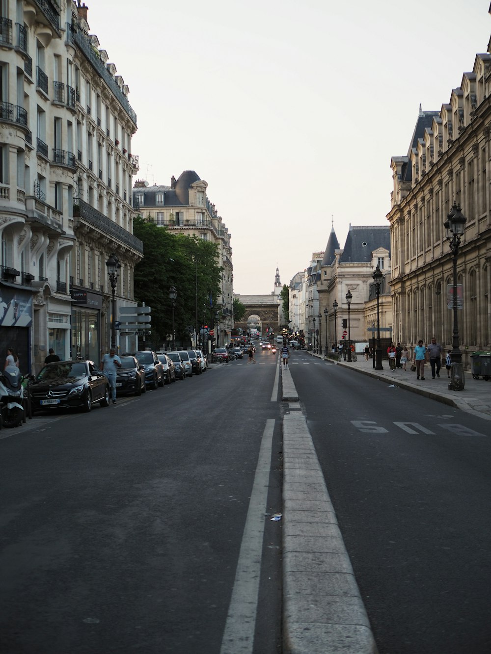 a city street with cars parked on both sides