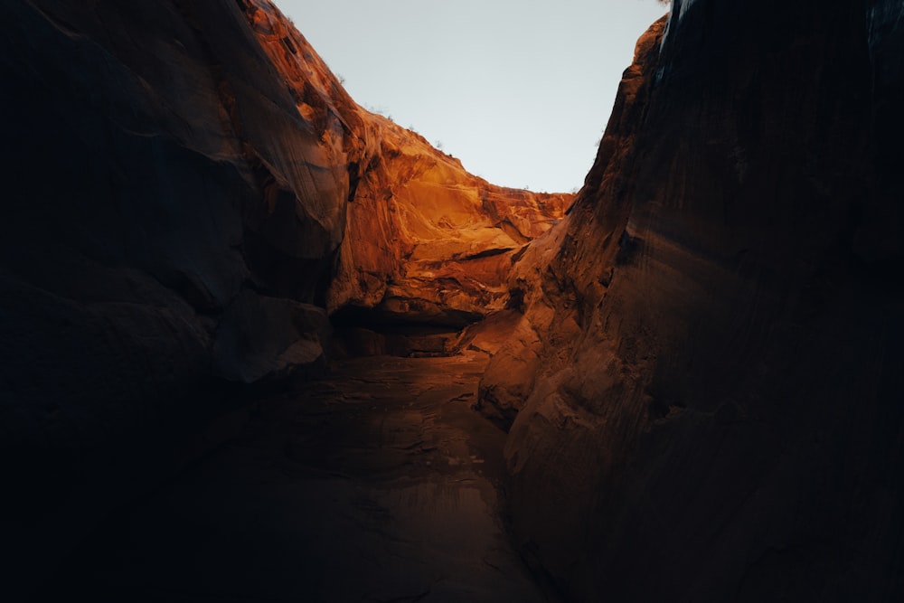 a narrow narrow canyon with a sky in the background