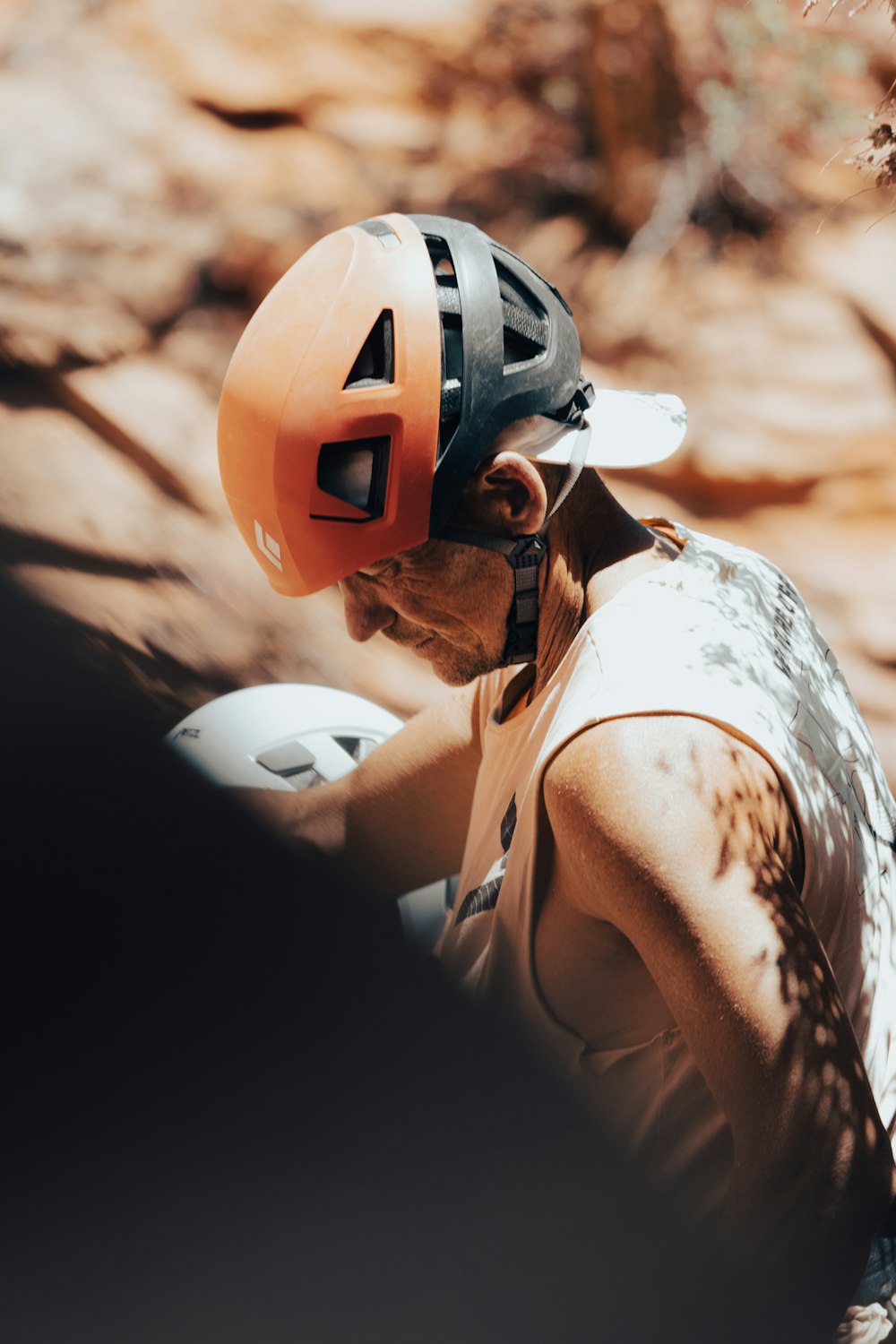 a man wearing a helmet and holding a baseball bat