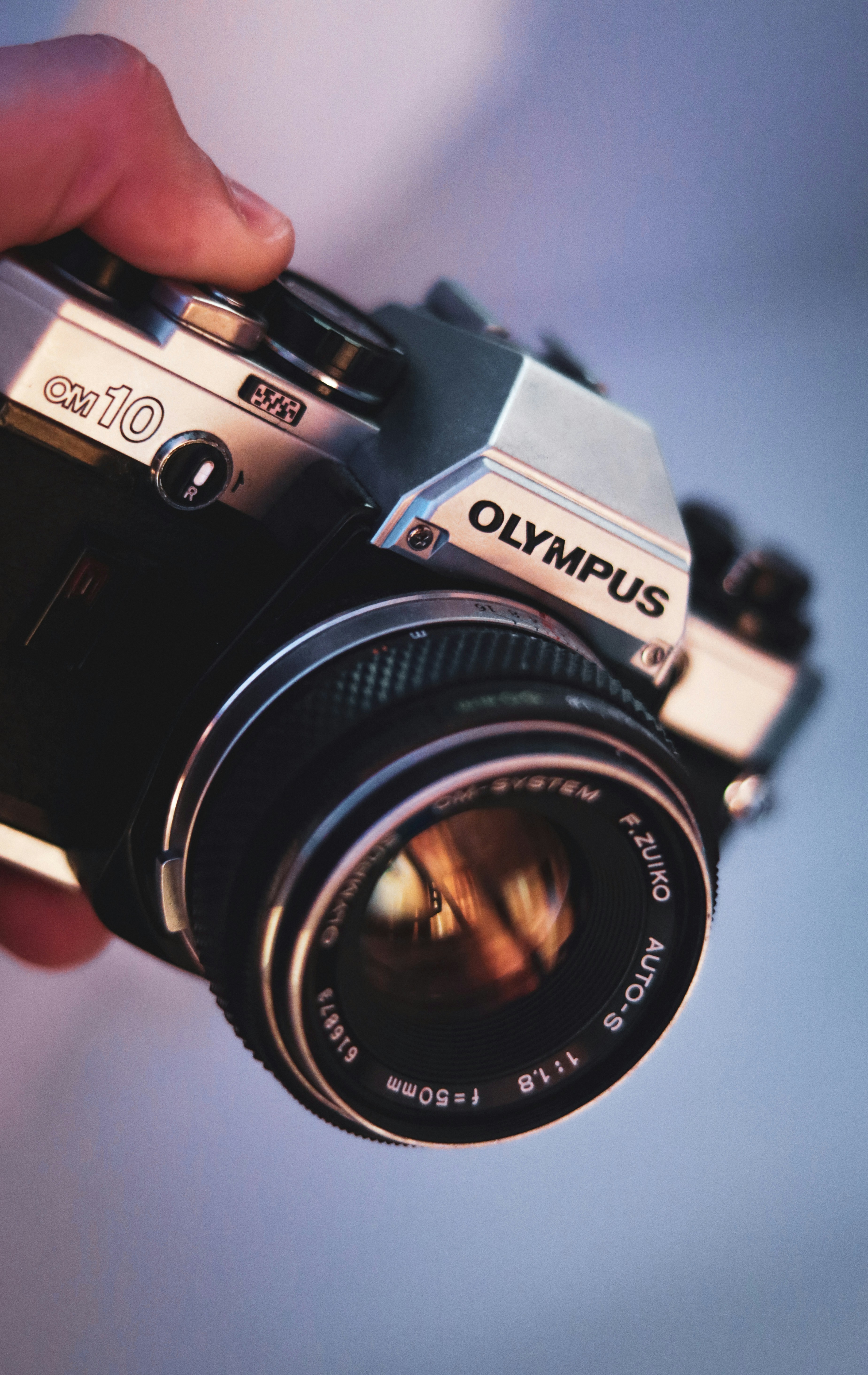 a person holding a camera in their hand