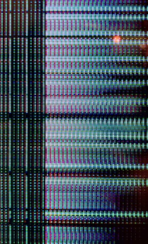 Close-up of a high-resolution LED panel showing colorful dynamic content in daylight