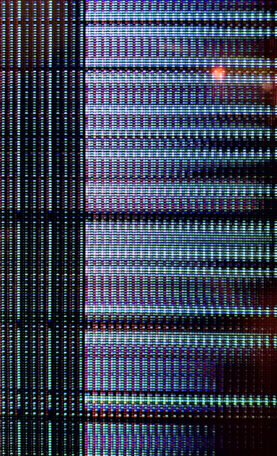 Close-up of a modern LED TV screen displaying vibrant colors