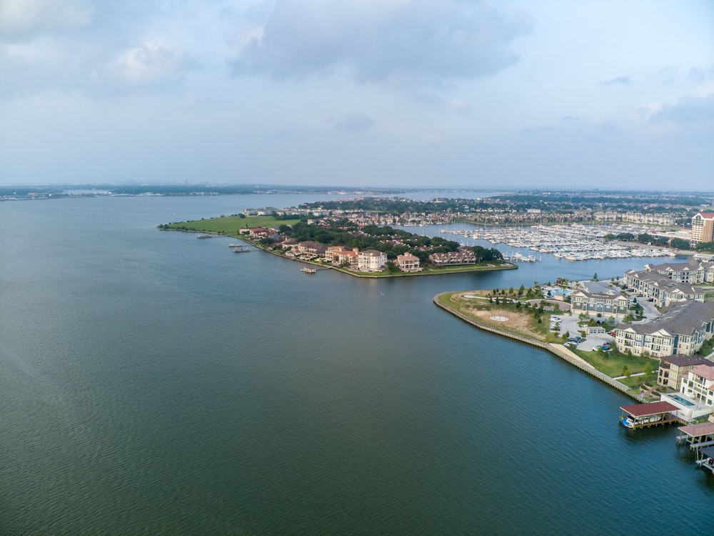 a large body of water with a city in the background