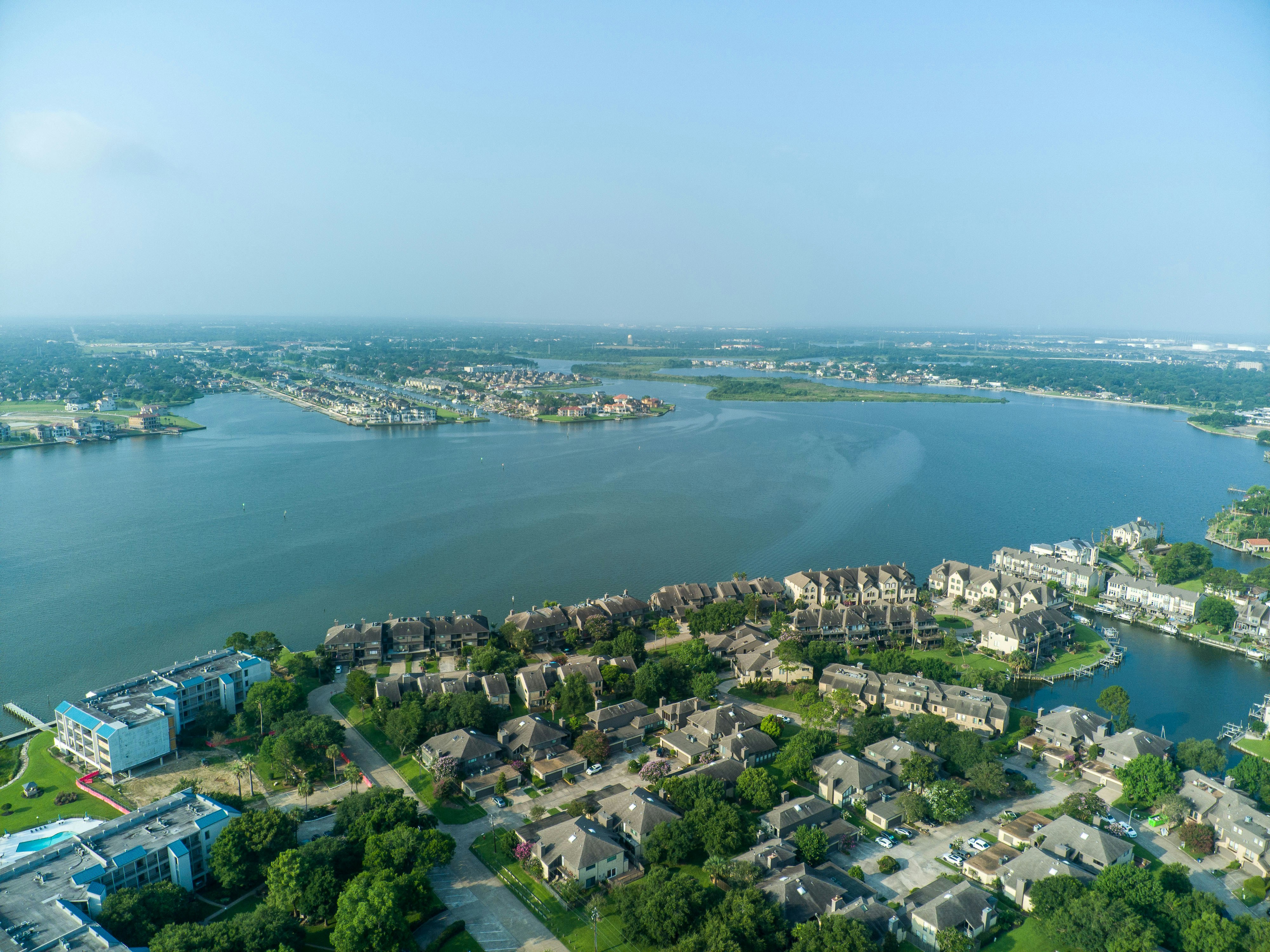 an aerial view of a city and a body of water
