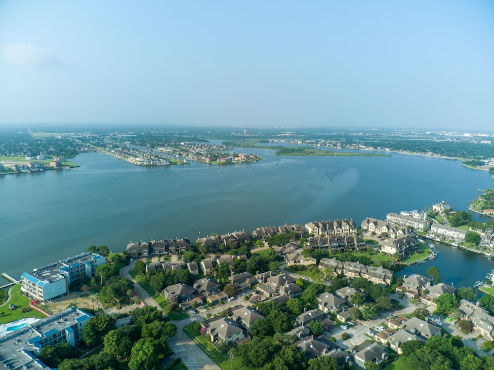 an aerial view of a city and a body of water