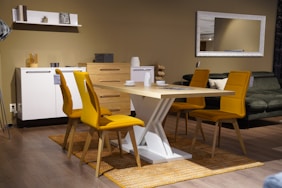 a room with a table, chairs, and a couch