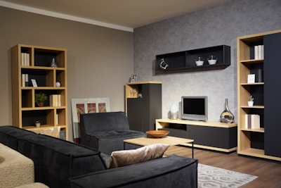 A cozy living room featuring a plush sofa and smart storage units from rcym.
