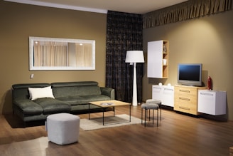 a living room filled with furniture and a flat screen tv