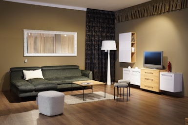 a living room filled with furniture and a flat screen tv