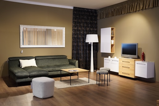 a living room filled with furniture and a flat screen tv