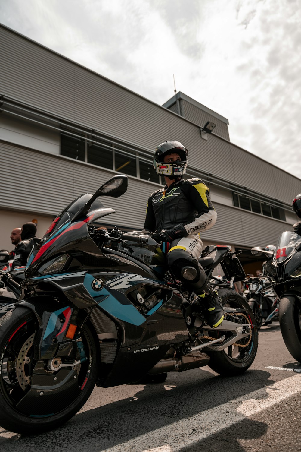 a couple of people that are sitting on motorcycles