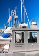 Experienced technician advising a boat owner near Saint Vaast la Hougue harbor.