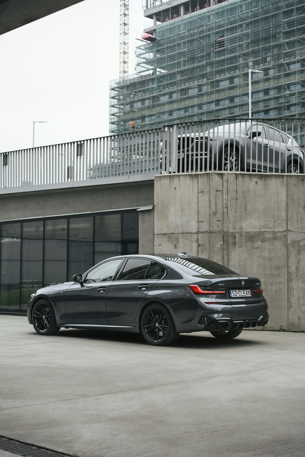 a black car parked in front of a building