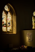 A warm, sunlit room inside the Mercy Home for Girls with colorful handmade crafts on the walls.