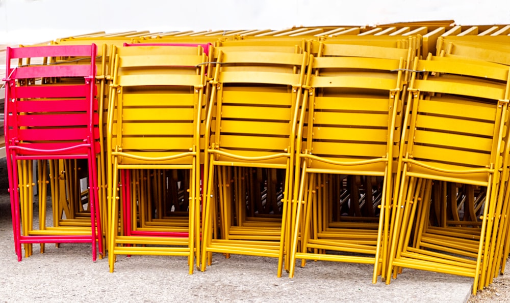 a row of yellow chairs sitting next to each other
