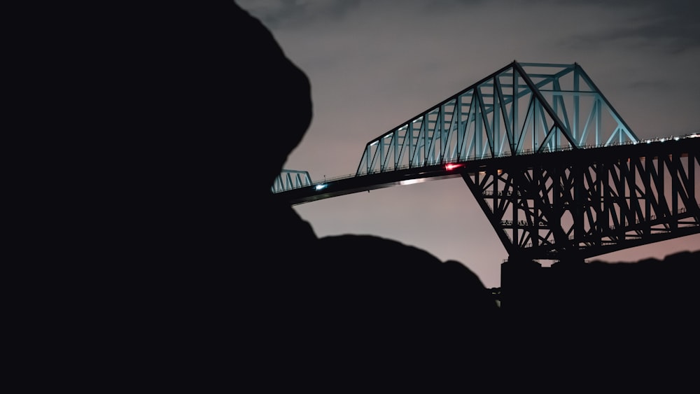 a bridge that is lit up at night