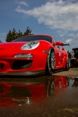 a red sports car parked on the side of the road