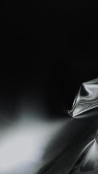 Elegant mocha textured surface with gentle curves suggesting flow.