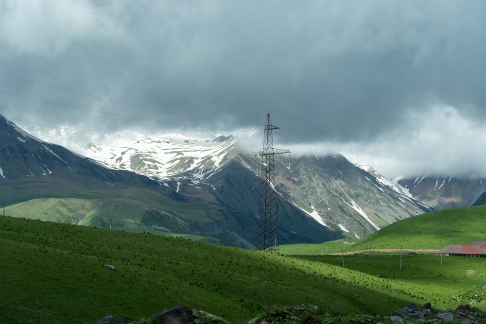 a mountain range with a telephone pole in the foreground