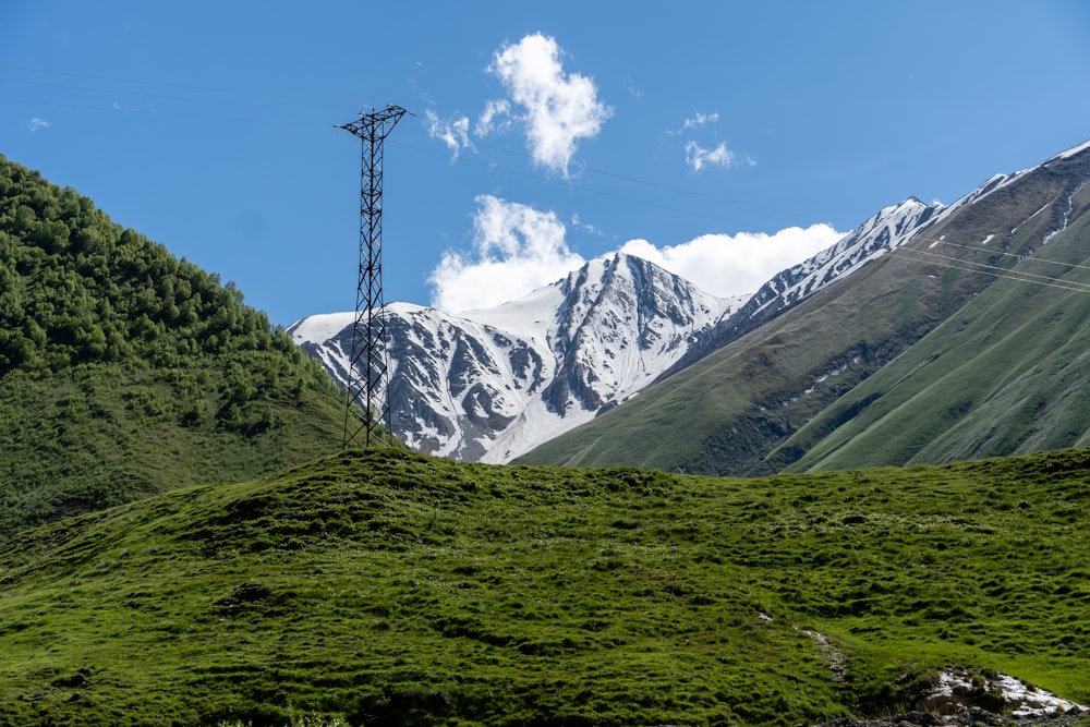a view of a mountain range with a power line in the distance