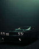Side view of a Dodge Charger showcasing sleek side skirts and wide fender flares under moody lighting.