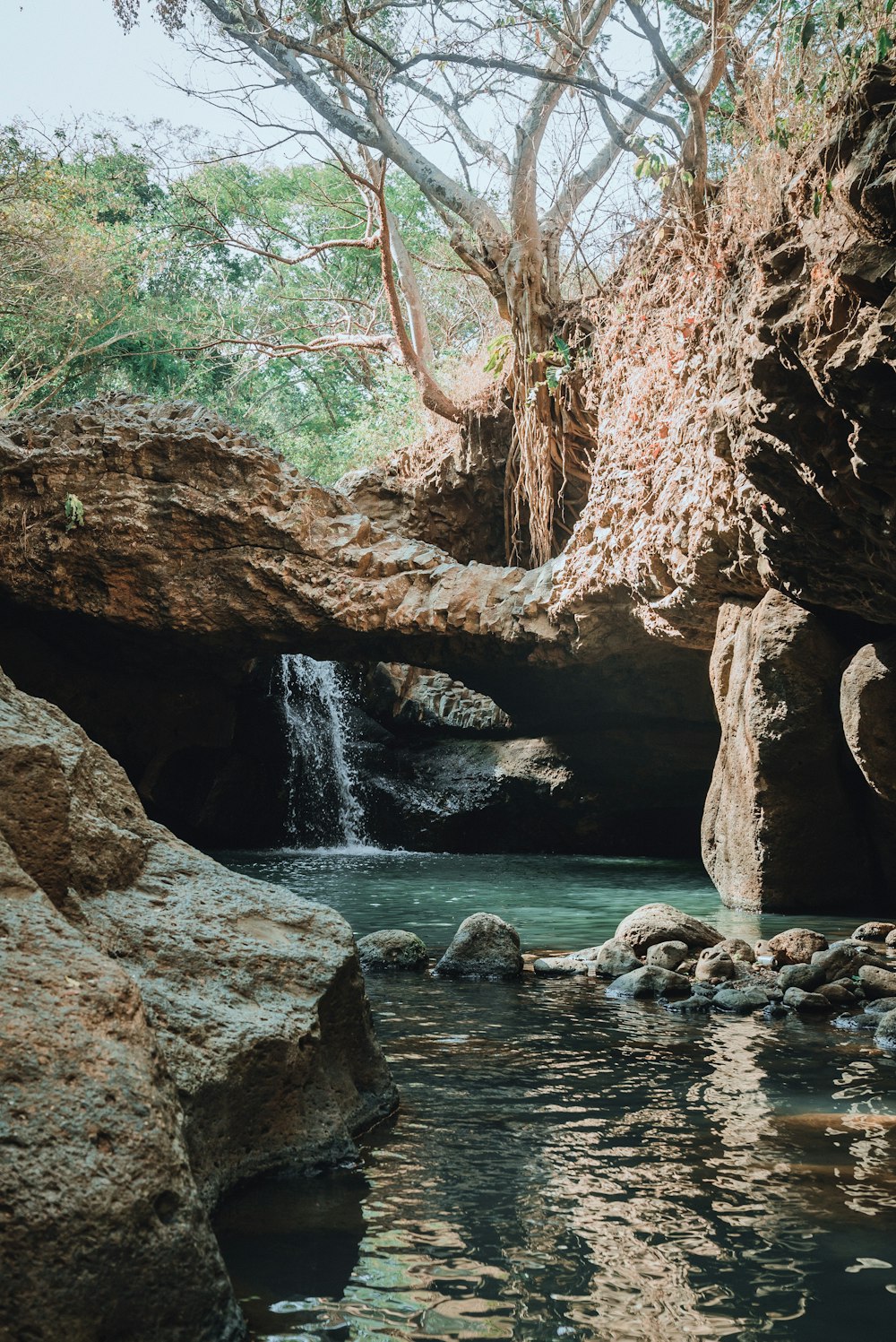 a small waterfall flowing into a pool of water