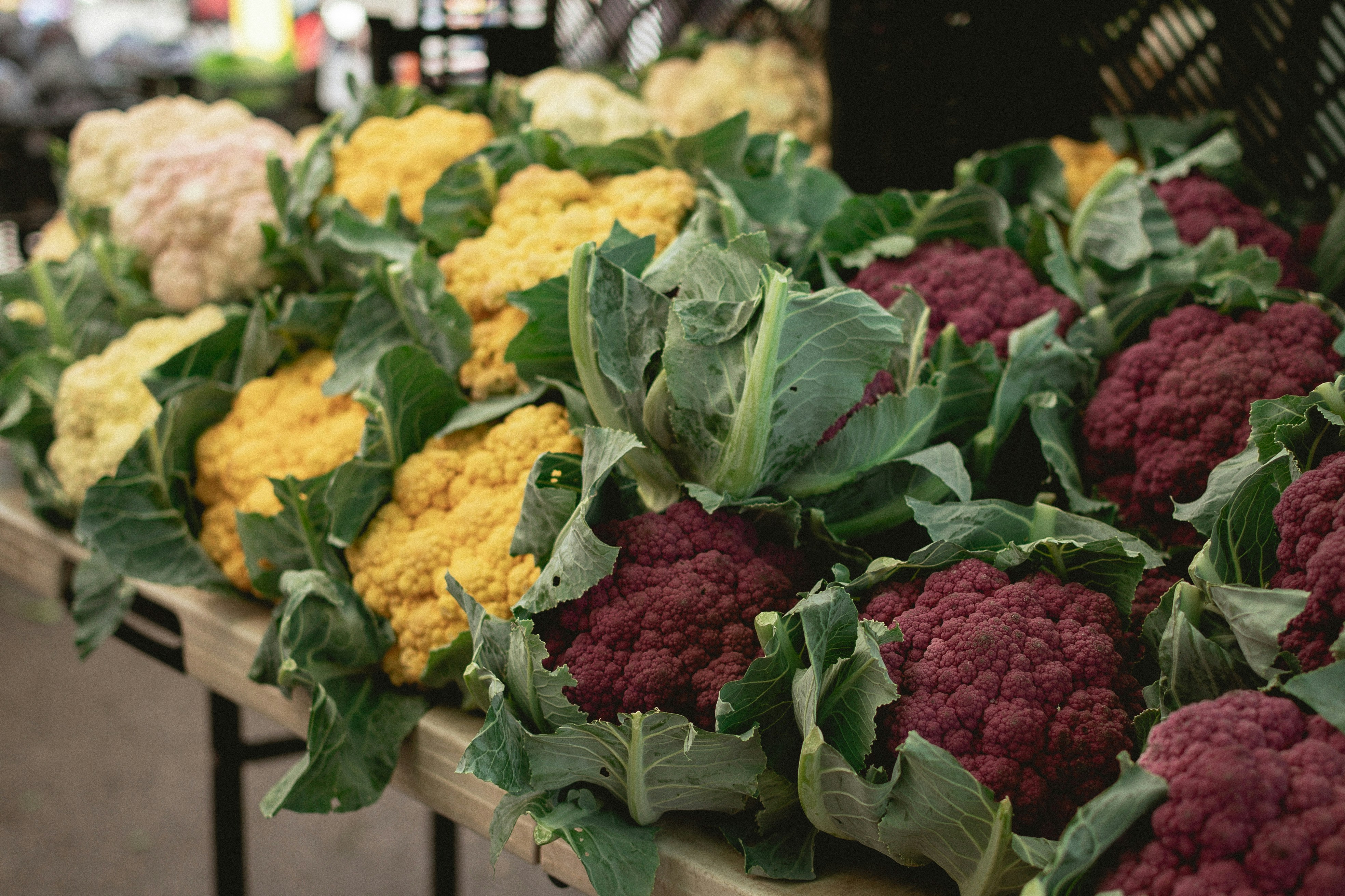 a bunch of broccoli and cauliflower on a table